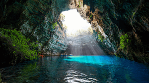 Melissani lake,  the underground lake. Take a boat ride and experience the magic